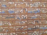 a picture of a wall that has many pictures on it