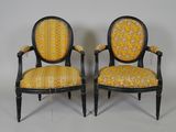 pair of black and yellow upholstered chairs