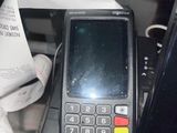 a cell phone sitting on top of a cash machine