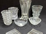 a lot of glass items that are sitting on a table