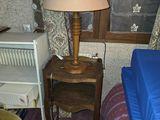 an image of a bedroom with a lamp and a bed