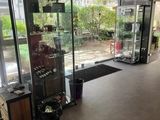 a room with a lot of glass doors and a lot of windows