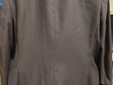 an image of a jacket on a hanger in a clothing store