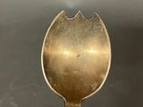 a close up of a spoon on a table