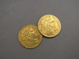 two gold coins, one of which is a sovereign and the other of which is a sovereign