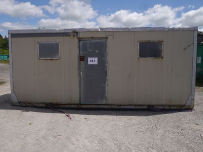 a small building that has a sign on the side of it