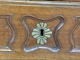 a close up of a wooden cabinet with a keyhole on it