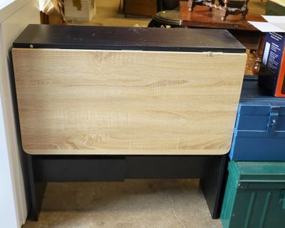 an image of a small table with a drawer underneath it