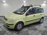 a small yellow car with a roof rack on it