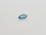 a blue topazte gems on a white surface