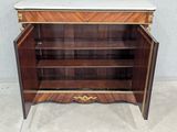 a wooden cabinet with a marble top and shelves