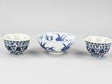 three chinese blue and white bowls
