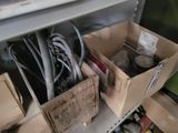 two boxes with wires and other items in them