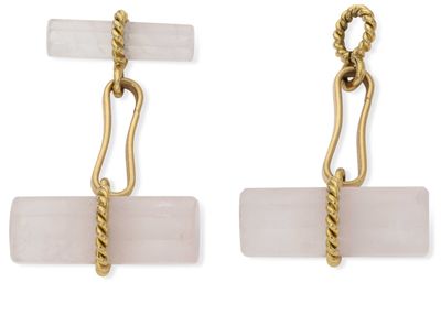 a pair of earrings with a rope and a pink stone