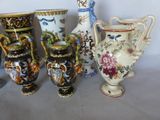 many vases that are sitting on a table