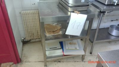 a small table with a sandwich on it in a kitchen