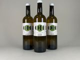 three bottles of olive oil on a white surface