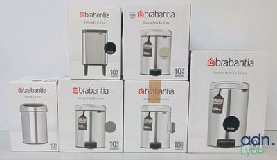 several boxes of coffee machines are stacked on top of each other