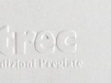 a close up of a white business card with a logo on it