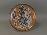 an image of a decorative plate with a stylized design on it