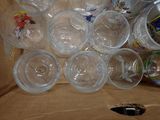 a box full of empty plastic cups and a pair of scissors