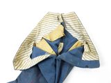 a folded piece of cloth on a white surface