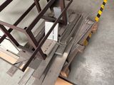 many pieces of wood on a pallet in a warehouse