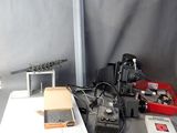 a laptop computer sitting on top of a table next to a camera