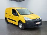 yellow citrole van parked in a white room with a black floor