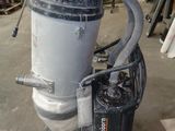 a machine that is sitting on a cart in a garage