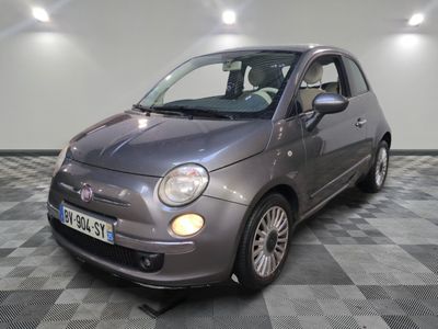 a picture of a small car parked in a garage