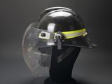 a close up of a helmet on a mannequin head on a black background