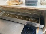 a counter top with bread in it and a basket on the counter