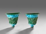 pair of green and blue vases with designs on them
