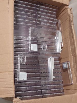 a cardboard box that has a bunch of cds in it