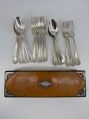 five forks and a spoon in a wooden case
