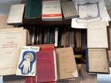 a lot of books on a shelf in a room