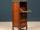 an old wooden cabinet with a marble top and drawers