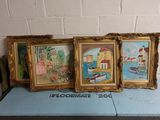 three framed paintings of boats on a table in front of a brick wall