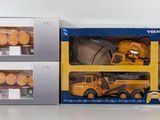 three toy trucks that are sitting on a table