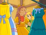 a lot of dresses hanging on a rack in a room