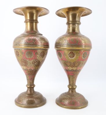 pair of antique brass vases with red and gold designs on them