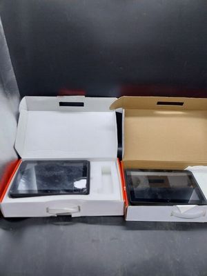 a box with a tablet in it and a box with a phone in it
