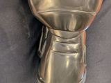 a metal cup that is sitting on top of a table