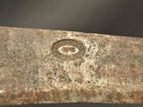 a close up of a metal object with a face on it