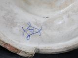 a white plate with a blue design on it