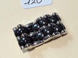 a picture of a bracelet with black beads and a price tag