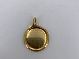 a gold locke with a small round locke on it