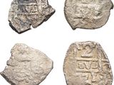 four ancient silver coins, one of which is a roman coin and the other of which is a roman coin
