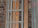 a ladder leaning up against a brick wall in a room